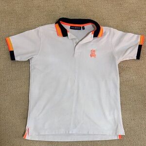 Psycho Bunny Kids Polo in White with Orange and Black Trim